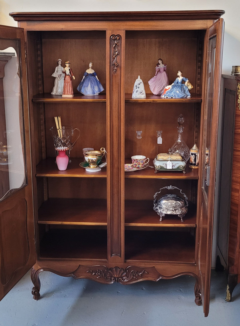 French Walnut Louis XV Style two half glass, door bookcase with three adjustable shelves. Sourced from France and in good original detailed condition.