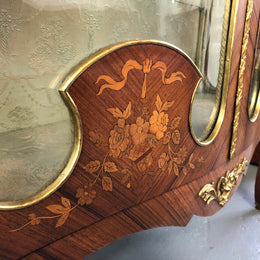 19th Century ornate French Walnut marquetry inlay display cabinet. Has beautiful ornate ormolu mounts and its original glass. In good original detailed condition.