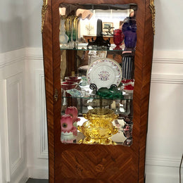 A Louis XV style Kingwood vitrine with marble top. It has beautifully floral inlay with ormolu mounts.
