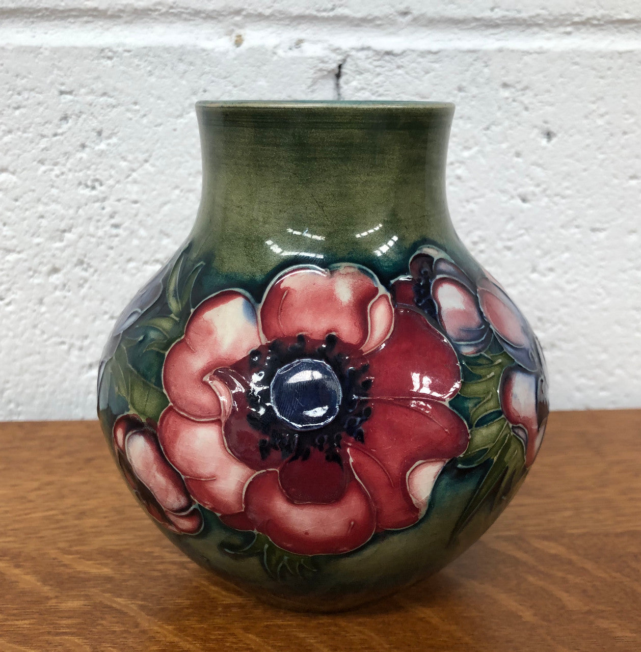 Anemone pattern hand-painted Moorcroft vase, in good condition.