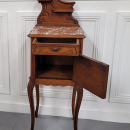 French Louis XV style Walnut single bedside cupboard with inset marble top. It has been sourced from France and is in good original detailed condition.