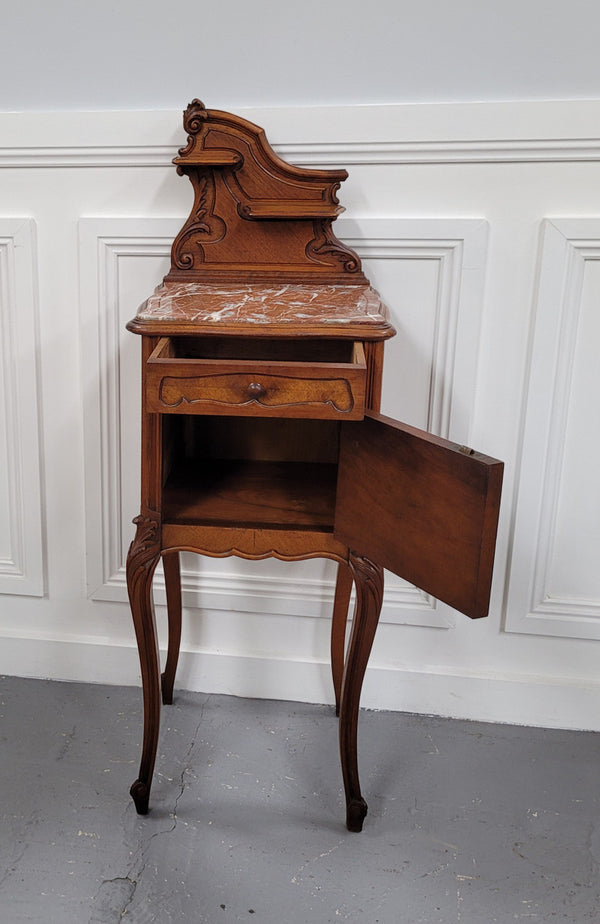 French Louis XV style Walnut single bedside cupboard with inset marble top. It has been sourced from France and is in good original detailed condition.