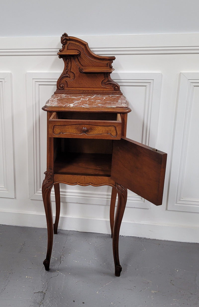 French Louis XV style Walnut single bedside cupboard with inset marble top. It has been sourced from France and is in good original detailed condition.