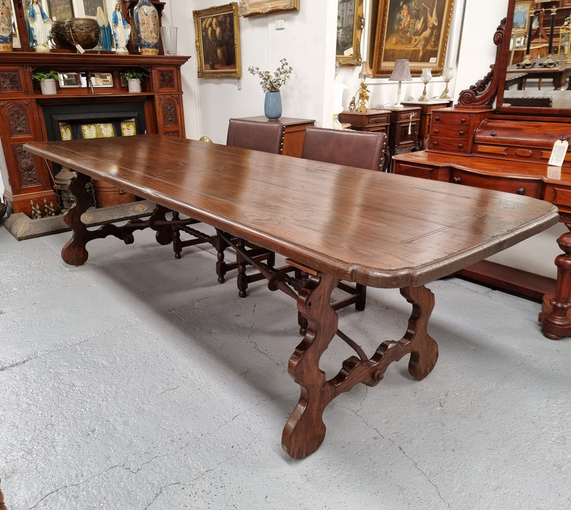 Amazing hard to find French Fruitwood Spanish style 3 meter dining table. Decorative iron work underneath and in good detailed original condition.
