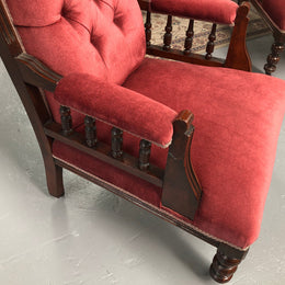 Beautiful pair of carved Edwardian arm chairs with lovely pink upholstery with button backs. In good condition.