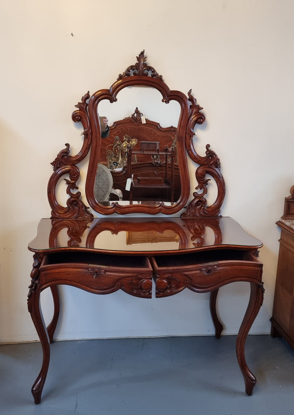 Walnut Parisian late 19th Century dressing table with mirror. Also has a glass top for protection, mirror moves and has drawers with key and working locks. In good original detailed condition.