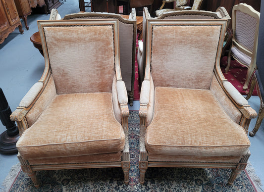 Pair of Louis XVI style painted arm chairs with carving & fluted legs. They have been sourced from France and the fabric is in good used original condition. Please view photos as they help form part of the description.