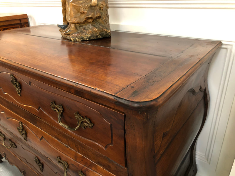 Beautiful 18th Century French all Cherrywood three drawer commode with beautiful ormolu mounts and handles. It is in good original detailed condition.
