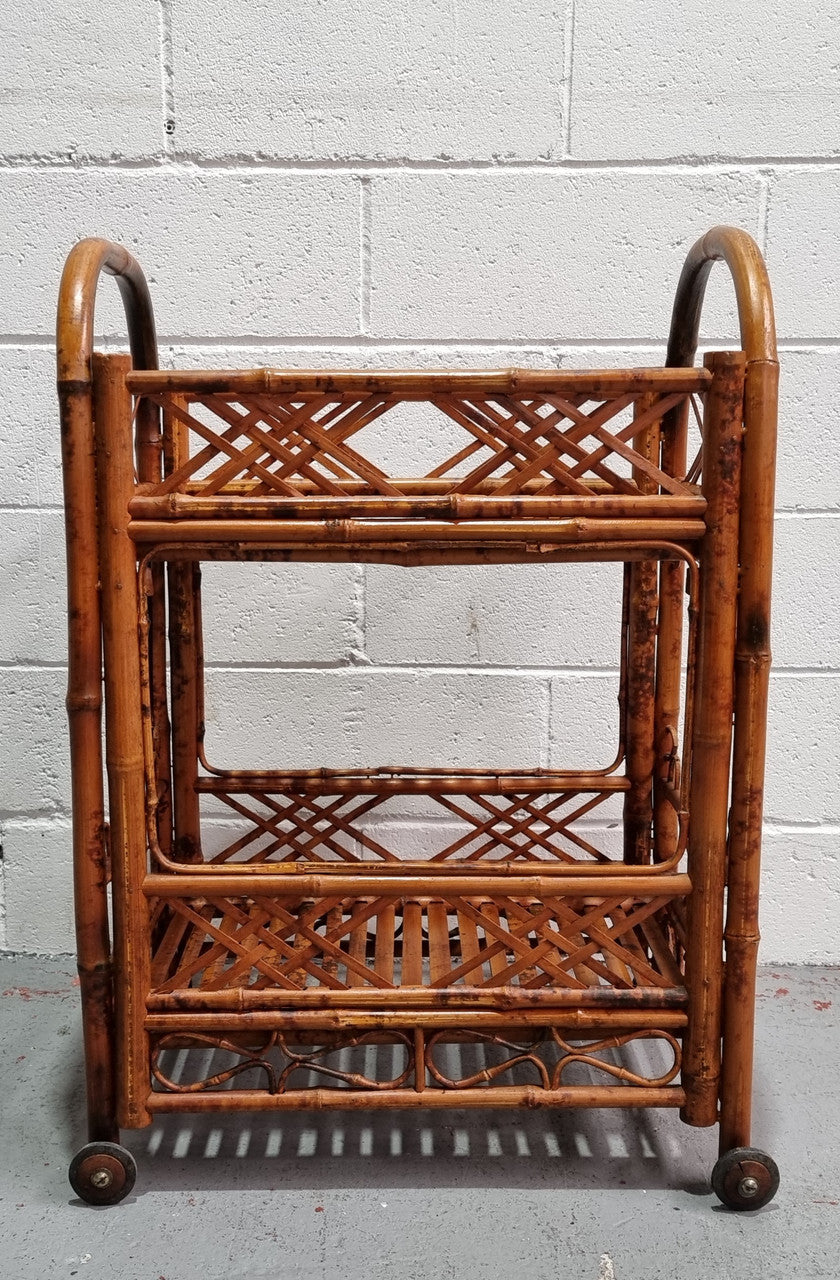 Excellent Vintage Tortoiseshell Bamboo two tier auto trolley. It has been sourced locally and is in fantastic original detailed condition .