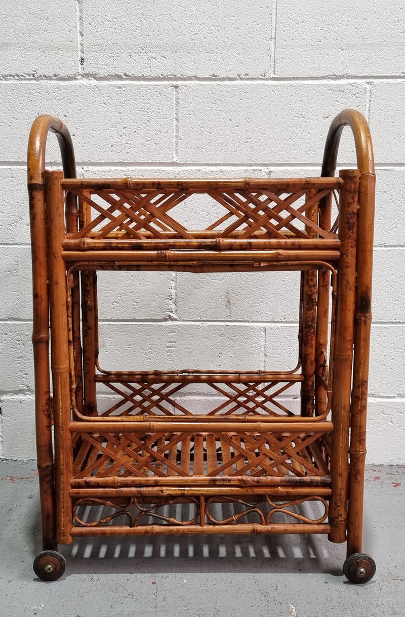 Excellent Vintage Tortoiseshell Bamboo two tier auto trolley. It has been sourced locally and is in fantastic original detailed condition .