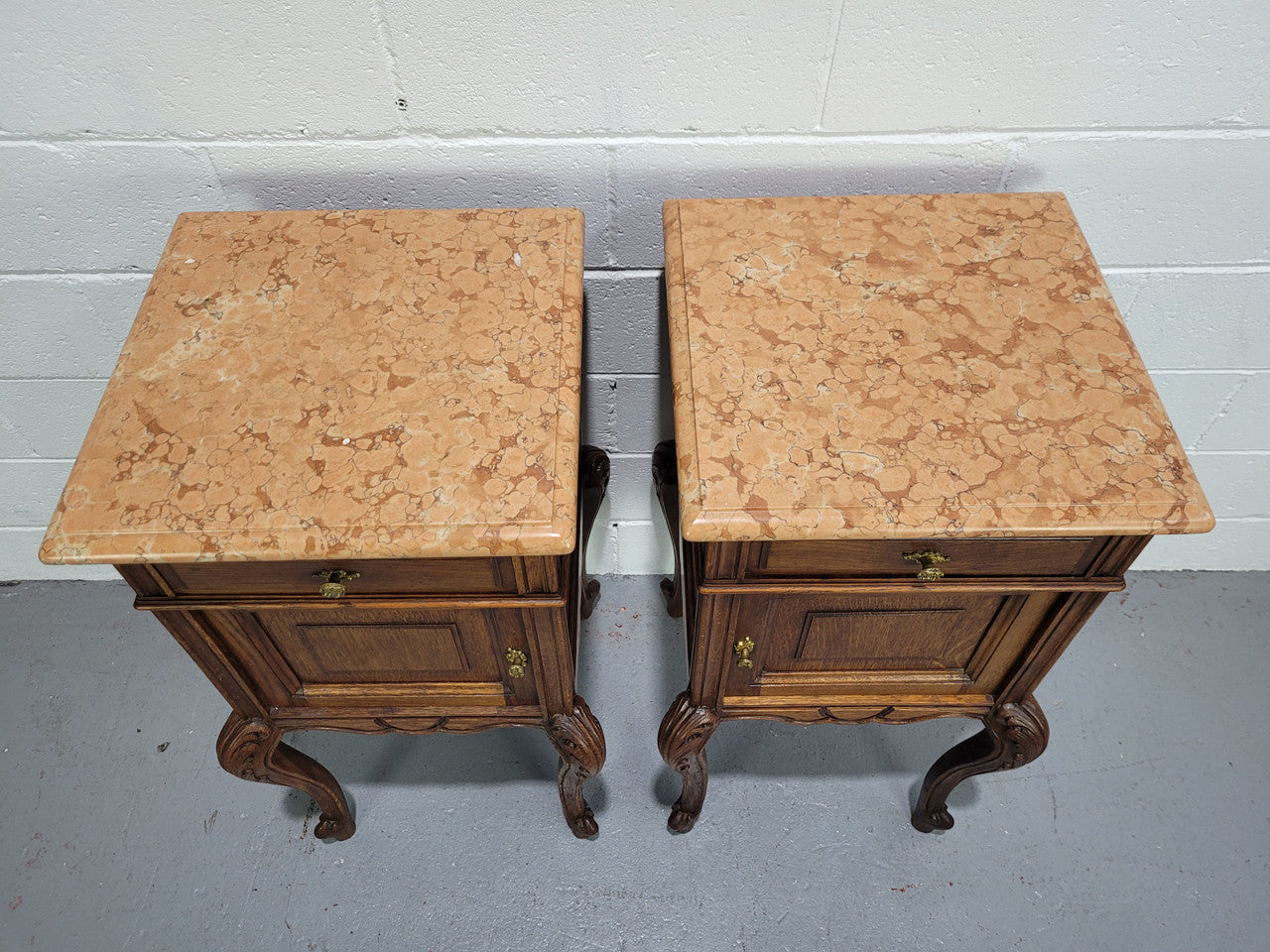 Stunning French walnut Henry II style marble top side cabinet with two drawers and two shelves inside. In good original detailed condition.