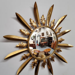 Stunning French Vintage gilt metal starburst convex mirror. It has been sourced from France and in good original detailed condition. Please note mirror does have some spotting due to age but only adds to its character.