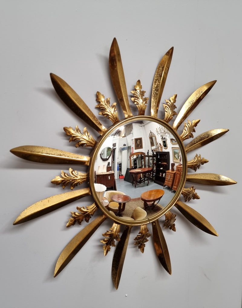 Stunning French Vintage gilt metal starburst convex mirror. It has been sourced from France and in good original detailed condition. Please note mirror does have some spotting due to age but only adds to its character.