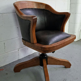 Antique French Oak newly upholstered "swivel action" office desk chair. In very good condition and very comfortable to sit in.