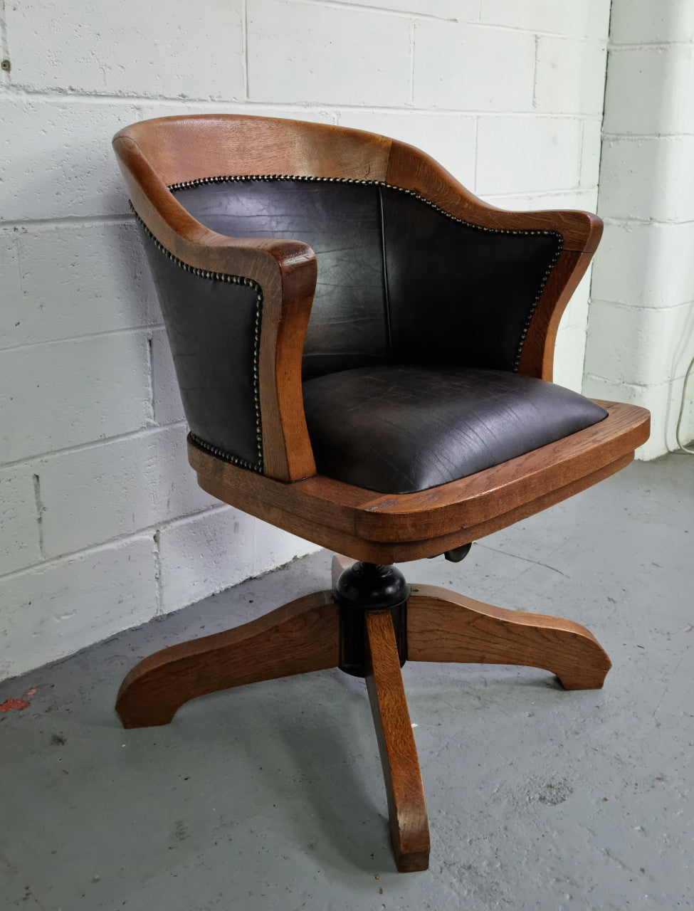 Antique French Oak newly upholstered "swivel action" office desk chair. In very good condition and very comfortable to sit in.