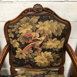 Pair of 19th Century French walnut tapestry covered arm chairs. They are in good original condition. Circa 1890.