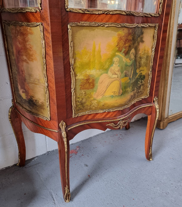 Lovely Vintage French Louis XVth style Vitrine. It has lovely gilt mount details and two glass shelves with room also for storage in good original condition.