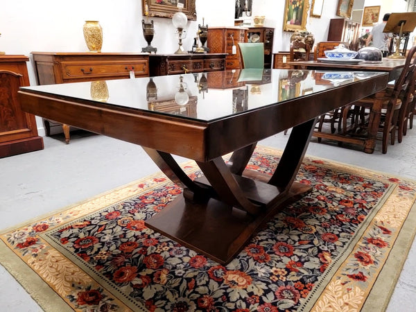 French Art Deco Figured Walnut dining table and six chairs. This stylish table also comes with a glass top and can be used with or without it. The chairs are very comfortable and the table can also fit another two chairs at either end making it a 6-8 seater. The table is in good original detailed condition with character marks to the top of table as shown in the pictures. This table and six chairs have been sourced locally.