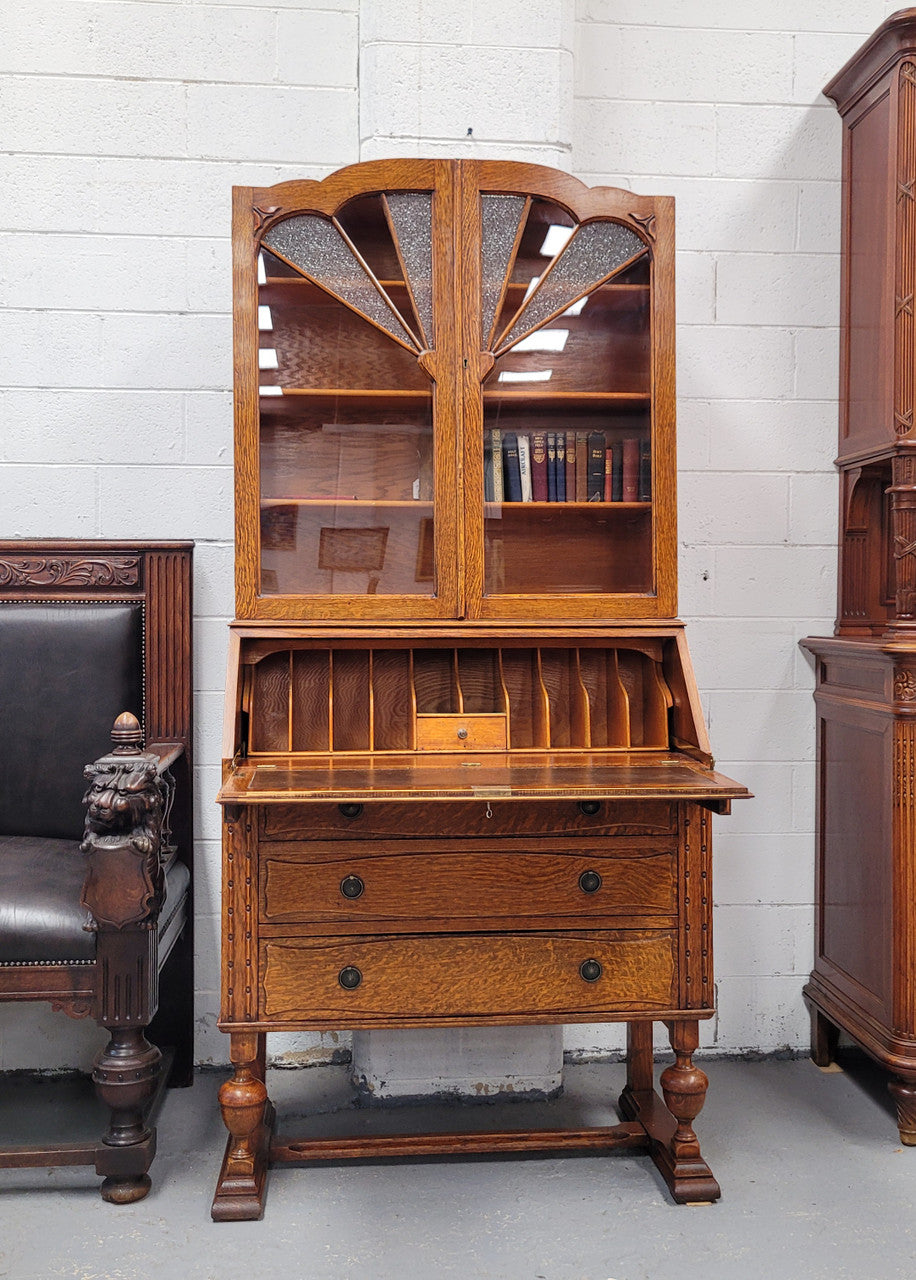 Stunning Art Deco secretary desk bookcase with heaps of storage space. It has a leathered writing area, bookcase with three adjustable shelves and three large drawers at the bottom. It has been sourced locally and in good original detailed condition.