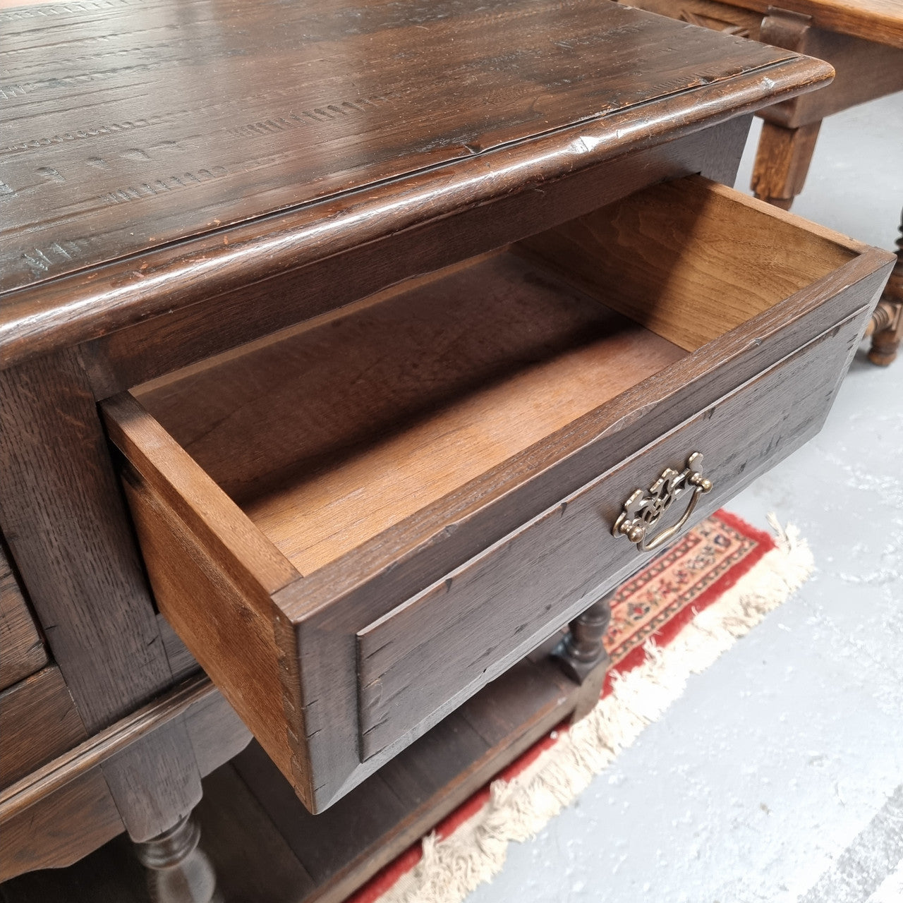 A very hard to find Vintage English kitchen dresser base of narrow proportions, sourced from France. In good original detailed condition.