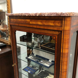 Beautiful French walnut and parquetry inlaid vitrine with lovely bevelled glass and a marble top. It comes with four glass shelves which are adjustable and it is in good original condition.