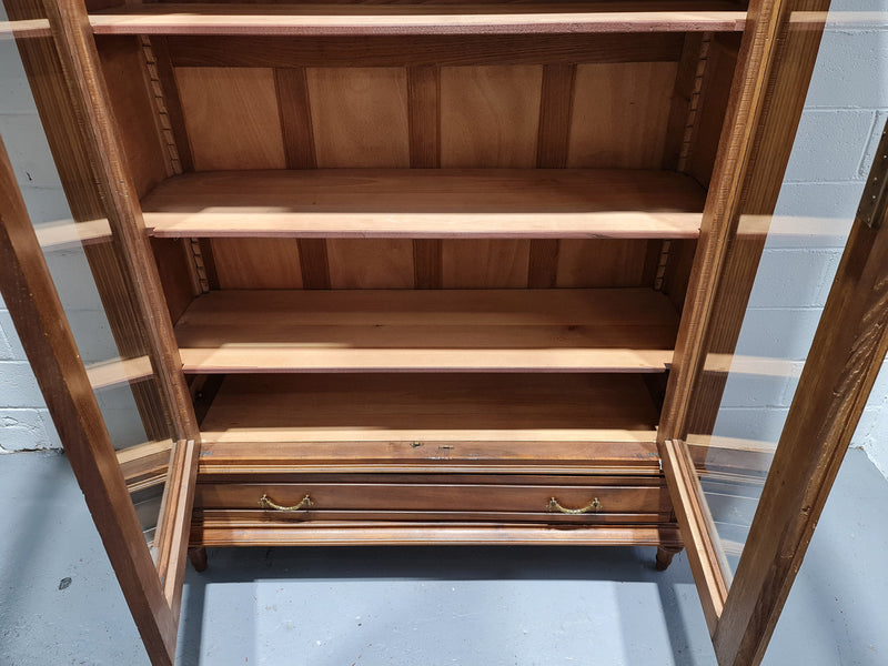 Stunning French Henry II style Walnut two door bookcase. In good original detailed condition.