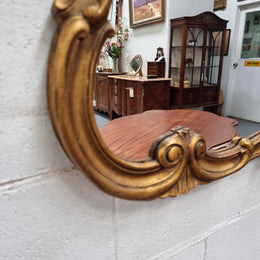 French Louis XV style wood carved and gilded mirror. Mirror is original and showing signs of age. It has been sourced from France and  in good original condition.