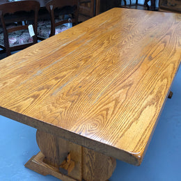 A French Style Oak stretcher base table with amazing wood grain. Can comfortable sit 6-8 people and is in original detailed condition.