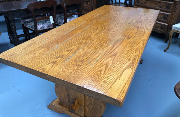 A French Style Oak stretcher base table with amazing wood grain. Can comfortable sit 6-8 people and is in original detailed condition.