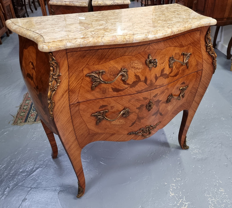 Fabulous French petite inlaid two drawer commode with ormolu mounts and lovely marble top. It is in good original detailed condition.