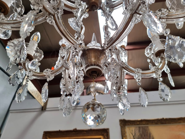 Sourced From France an attractive eight arm French crystal chandelier. It has been fully rewired to Australian standards and is in good original working condition.