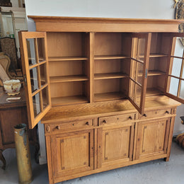 Edwardian Oak dwarf bookcase with six cupboards and three drawers. In very good original detailed condition.