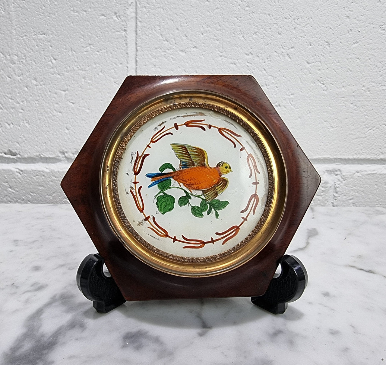 Antique French hand painted reverse on glass miniature in its original frame. In good original condition, please view photos as they help form part of the description.