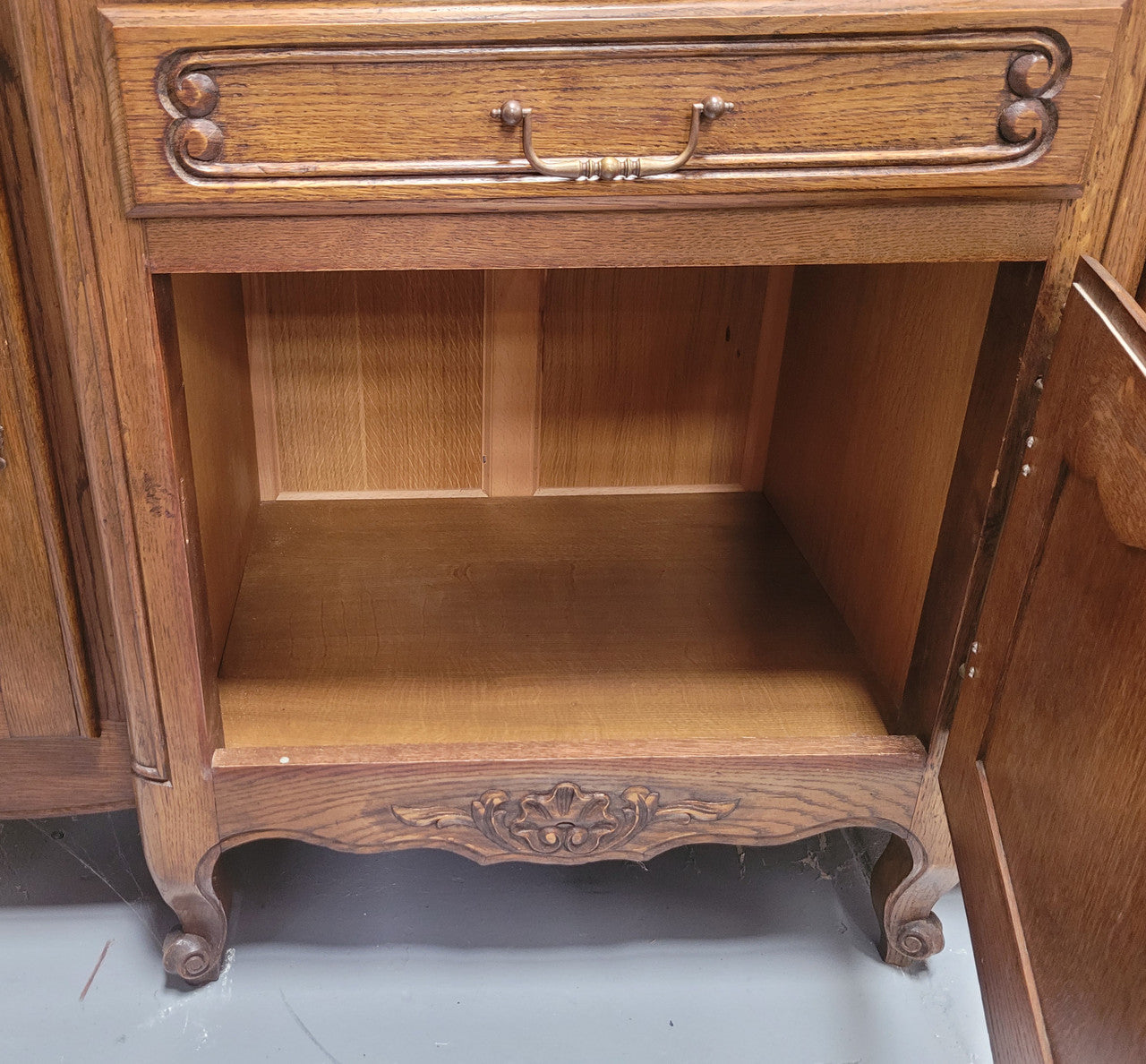 French Oak Louis XV style three door, two drawer, parquetry top sideboard. It has been sourced from France and is in good restored condition.