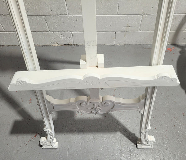 Rococo style white painted French style easel. It can be used as an easel or it has hooks on the sides and could be used to hang other items. In good original condition.