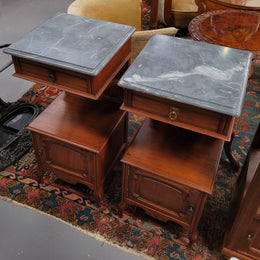 Pair of unusual transitional fruit wood marble top bedside cabinets. They have been sourced from France and are in good original detailed condition.
