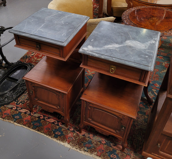Pair of unusual transitional fruit wood marble top bedside cabinets. They have been sourced from France and are in good original detailed condition.