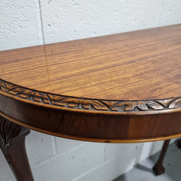 Chippendale style half round hall table. It is in good original detailed condition.