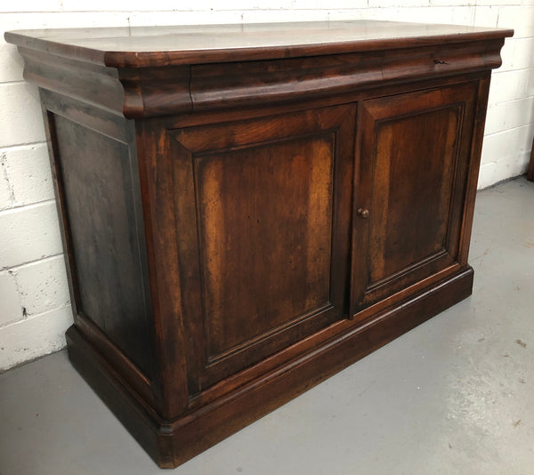 Lovely Early 19th Century French Walnut counter/sideboard with two drawers and cupboards for all your storage needs. It is in good original detailed condition.