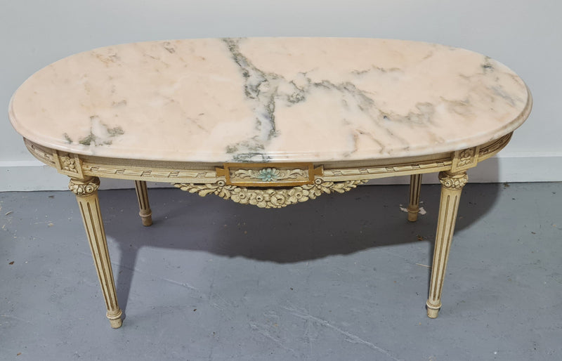 Charming painted Louis XVI style oval marble top coffee table. In good original detailed condition.