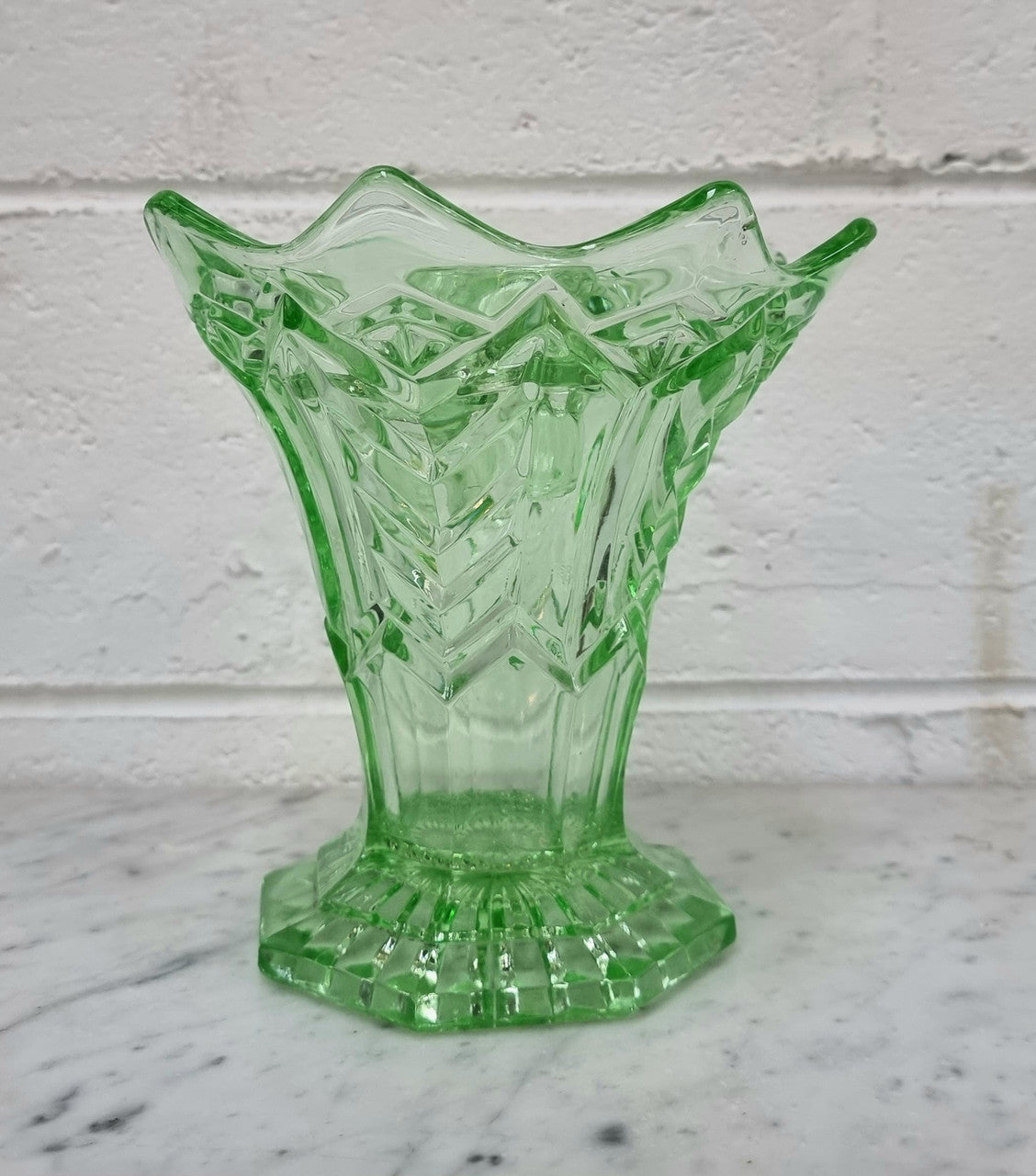 Beautiful green depression glass flower vase with insert. in good original condition.