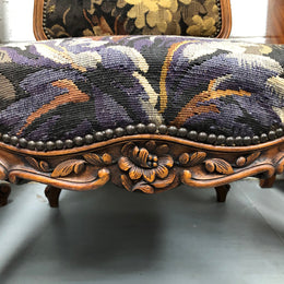 Pair of 19th Century French walnut tapestry covered arm chairs. They are in good original condition. Circa 1890.