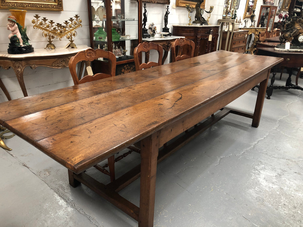 19th Century French three meter Farmhouse table with a beautiful original rustic top. In very good original detailed condition.
