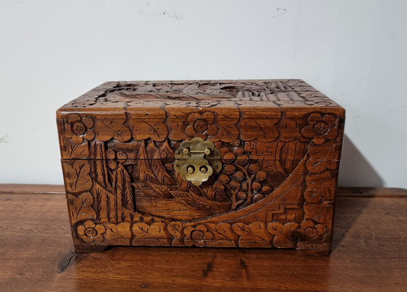 Small Chinese carved camphor wood jewellery box. It is in original condition.