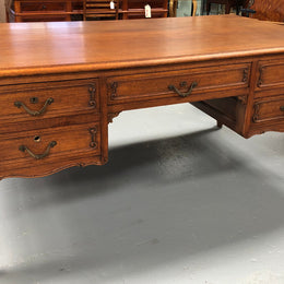 French Oak Louis XV style full partners desk with both sides having five functional drawers. In very good original detailed condition.