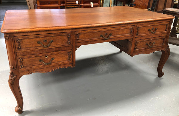 French Oak Louis XV style full partners desk with both sides having five functional drawers. In very good original detailed condition.