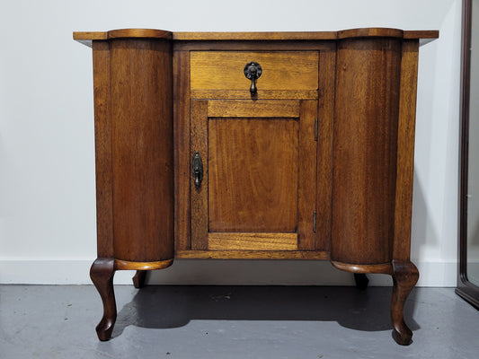 Queensland side cabinet of generous proportions. It has 1 drawer and one door with plenty storage space. In good original detailed condition.