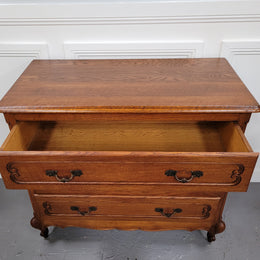 French Louis 15th style Oak three drawer chest of drawers with wooden top. It has been sourced from France and is in good original detailed condition.