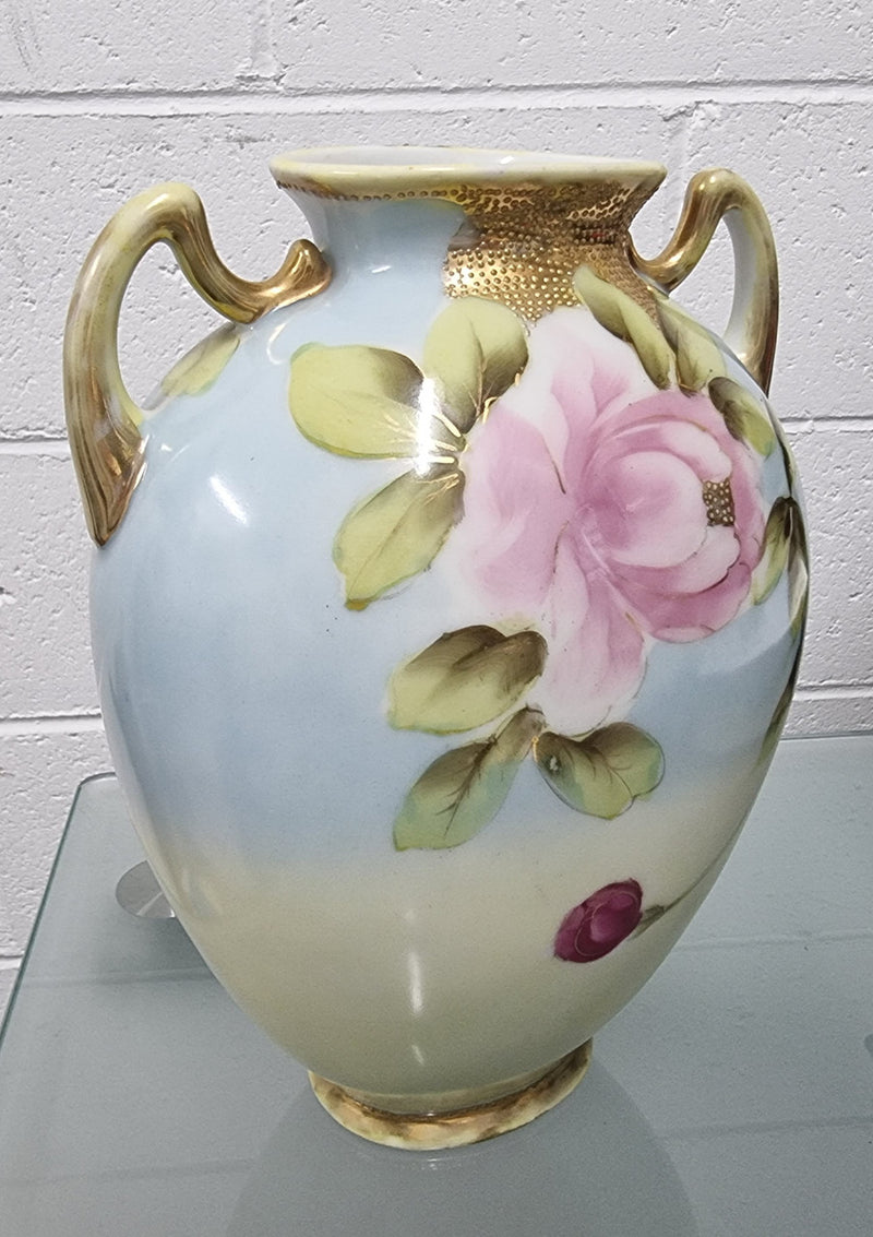 Lovely hand painted double handled vase in great original condition. Please see photos as it forms part of the description.