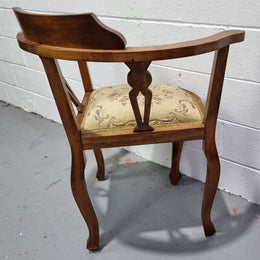 Mahogany upsholstered corner chair. It is in good original condition with clean upholstery.